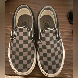 Black and gray checkered slip on Vans